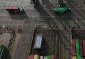 FELIXSTOWE (United Kingdom), 11/03/2026.- An image made with a drone shows trucks carrying containers at the Port of Felixstowe in Felixstowe, Britain, 11 March 2026. According to supply chain analytic firm project44, container shipment diversions have increased by more than 360 percent since the Strait of Hormuz was effectively declared closed amid the ongoing war between the United States, Israel, and Iran. British Prime Minster, Sir Keir Starmer has warned that the longer the conflict goes on, then the outlook will be worse for the long term UK economy. (Reino Unido, Estados Unidos) EFE/EPA/NEIL HALL
