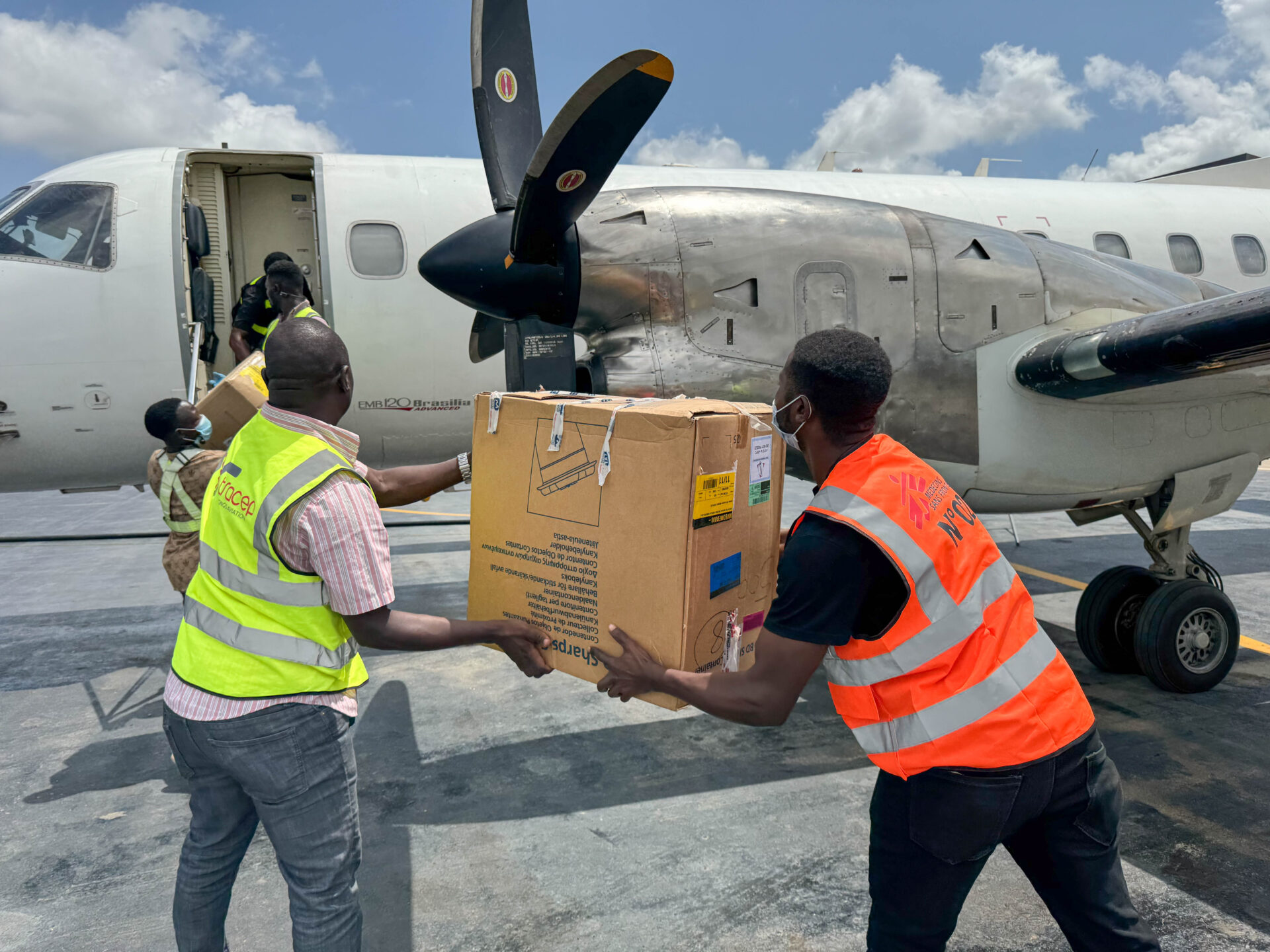 An MSF truck is loaded at Bunia airport with emergency response supplies delivered by cargo flight from MSF Support Unit Kampala (SUKA). The shipment includes 3,000 items of personal protective equipment (PPE) and medical supplies for the Ebola response.
