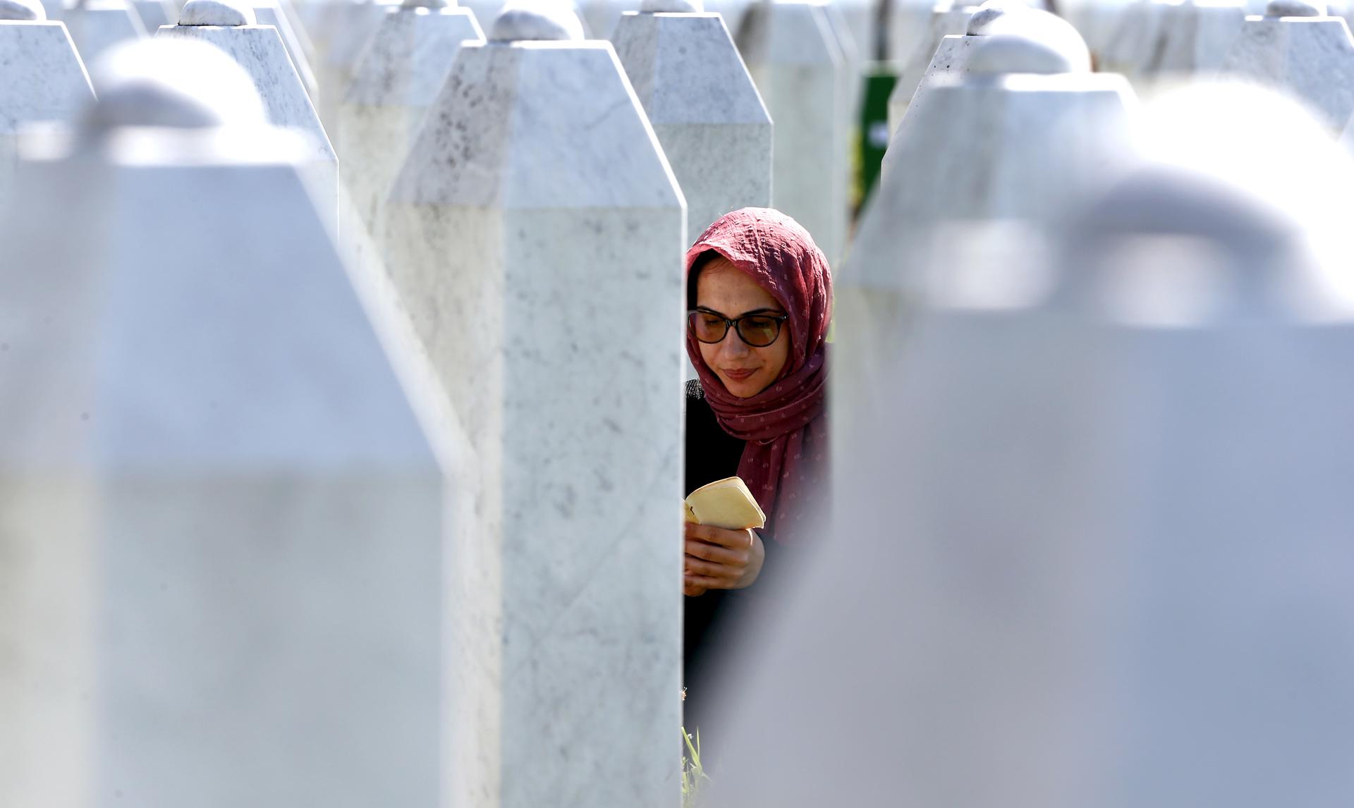 Srebrenica (Bosnia And Herzegovina), 11/07/2020.- A Bosnian Muslim woman pray during the funeral in the Potocari Memorial Center, Srebrenica, Bosnia and Herzegovina, 11 July 2020, where 9 newly-identified Bosnian Muslims.The burial was part of a memorial ceremony to mark the 25th anniversary of the Srebrenica genocide, considered the worst atrocity of Bosnia's 1992-95 war. More than 8,000 Muslim men and boys were executed in the 1995 killing spree after Bosnian Serb forces overran the town. (Bosnia-Herzegovina) EFE/EPA/FEHIM DEMIR