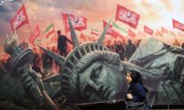 TEHRAN (IRAN(Islamic Republic Of)), 13/08/2026.- An Iranian woman walks next to an anti-US billboard at the Enghelab square in central Tehran, Iran, 13 August 2026. Tensions between Iran and the US remain high as opposing claims persist over shipping control in the Strait of Hormuz. (Teherán) EFE/EPA/ABEDIN TAHERKENAREH RESTRICTIONS: NO Access Israel Media/Persian Language TV Stations Outside Iran/Strictly No Access BBC Persian/VOA Persian/Manoto TV/Iran International TV. (As mandated by Iran's Directorate General for Foreign Media) --