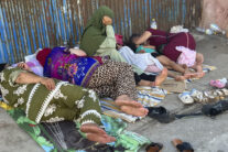 Migrantes y menores en las naves del Tarajal a la espera de ser realojados.