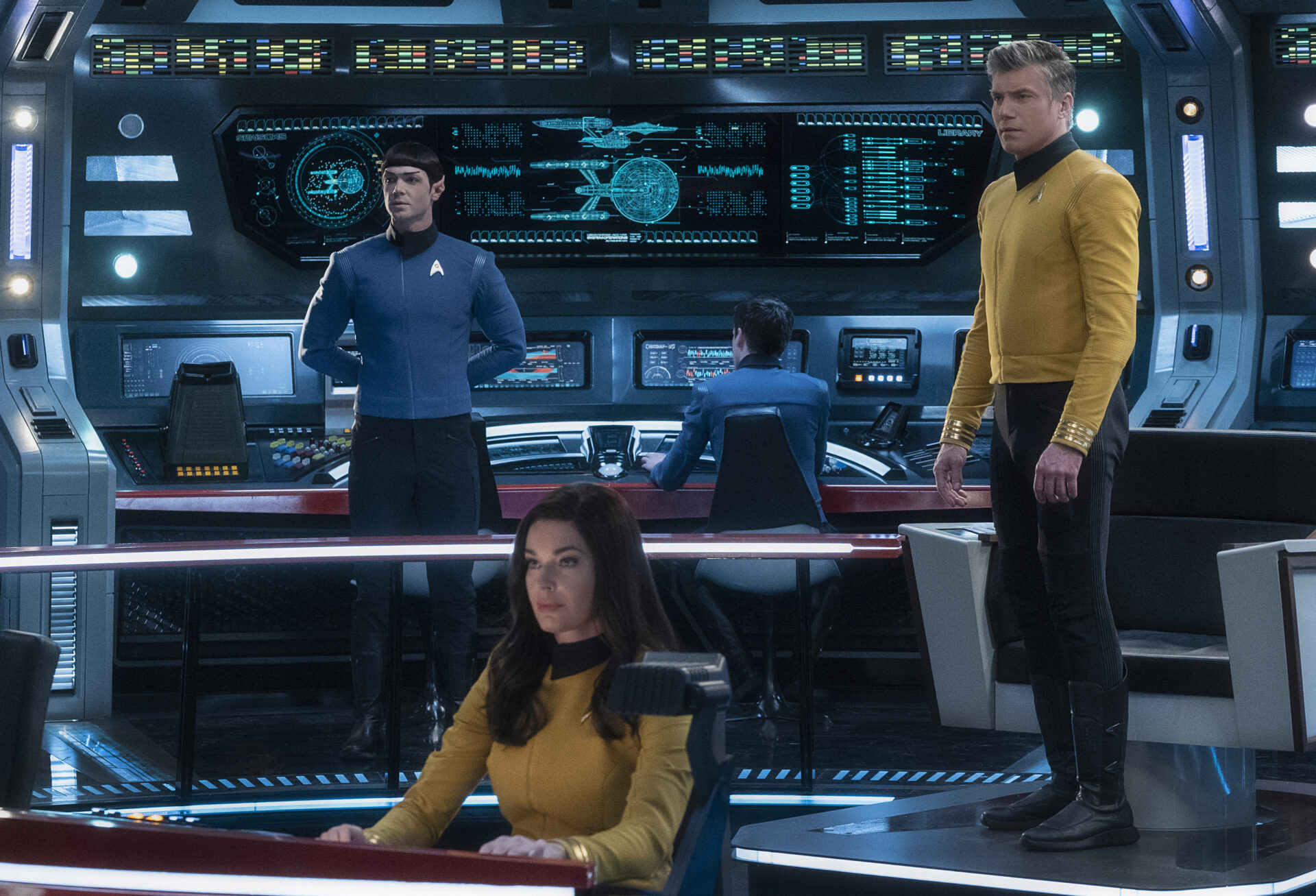"Q&A" -- Episode SF #007 -- Pictured (l-r): Ethan Peck as Spock; Rebecca Romijn as Number One; Anson Mount as Captain Pike of the the CBS All Access series STAR TREK: SHORT TREKS. Photo Cr: Michael Gibson/CBS ©2019 CBS Interactive, Inc. All Rights Reserved.