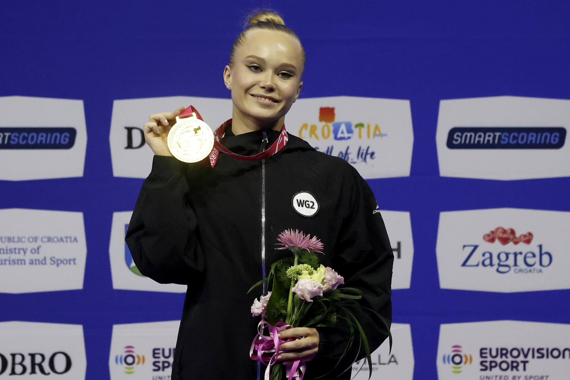 ZAGREB (Croatia), 15/08/2026.- Gold medalist Angelina Melnikova of Russia celebrates on the podium after the Apparatus Final Seniors Vault at the 36th European Women's Artistic Gymnastics Championships in Zagreb, Croatia, 15 August 2026. (Croacia, Rusia) EFE/EPA/ANTONIO BAT